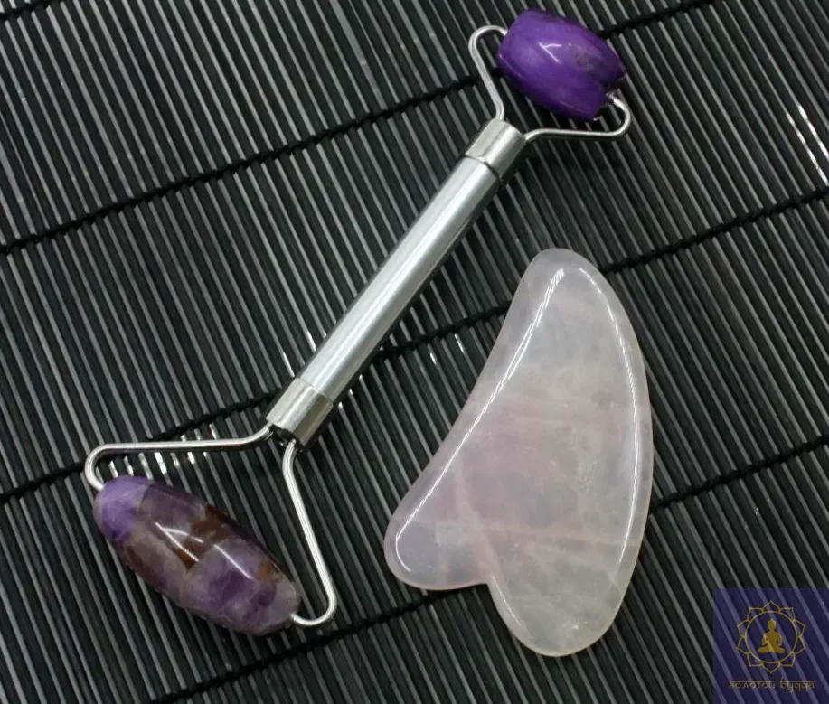 Масажний набір Гуа-ша, аметистовий ролик і скребок з рожевого кварцу.