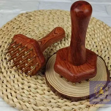 Масажер для меридіан із дерева з мідними вставками.